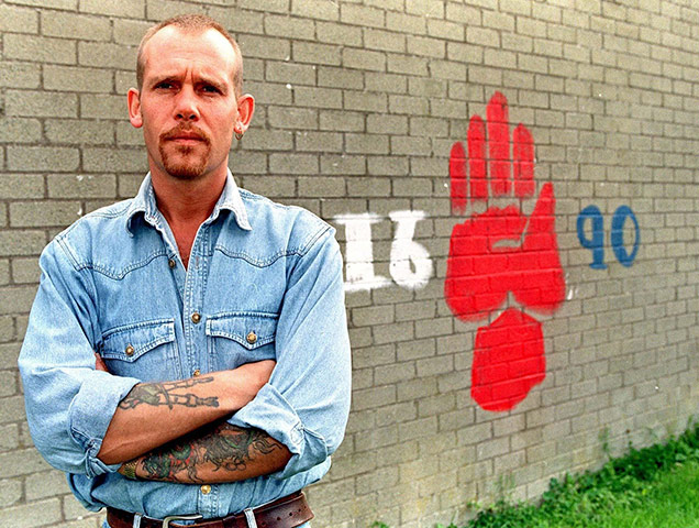 Billy Wright in front of a wall mural