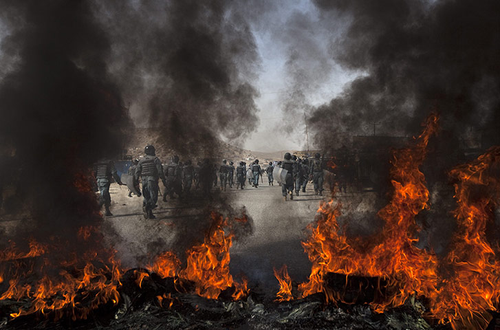 24 hours in pictures: Afghan police walk towards protesters in Kabul