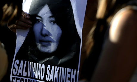 A demonstrator holds an image of Sakineh