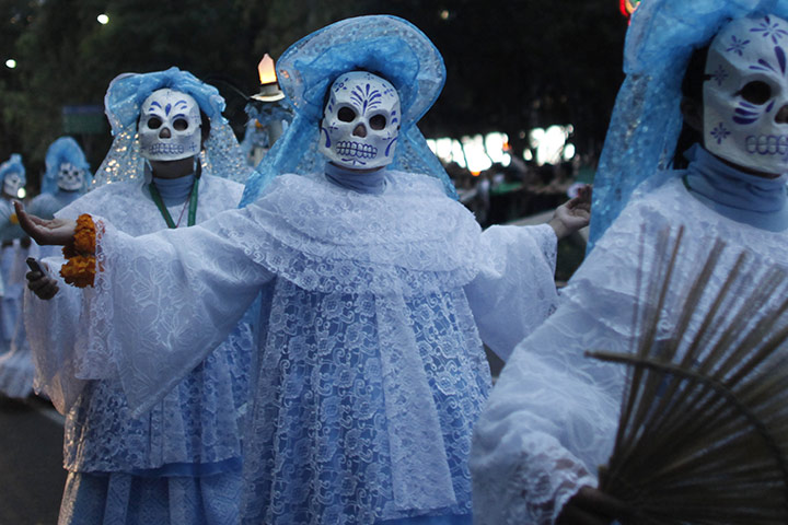 mexican celebrations: Women wear masks representing 