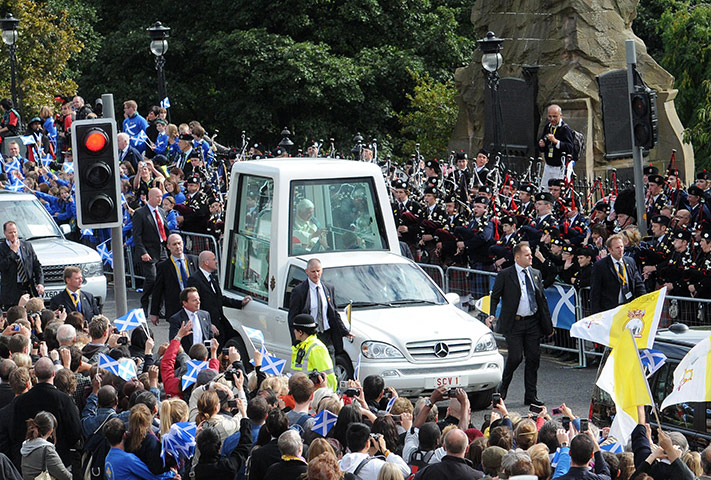 Pope day one: Pope Benedict XVI rides in the Popemobile down Edinburgh's Princes Street