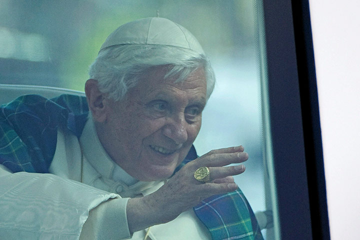 Pope day one: Pope Benedict XVI waves to the crowds