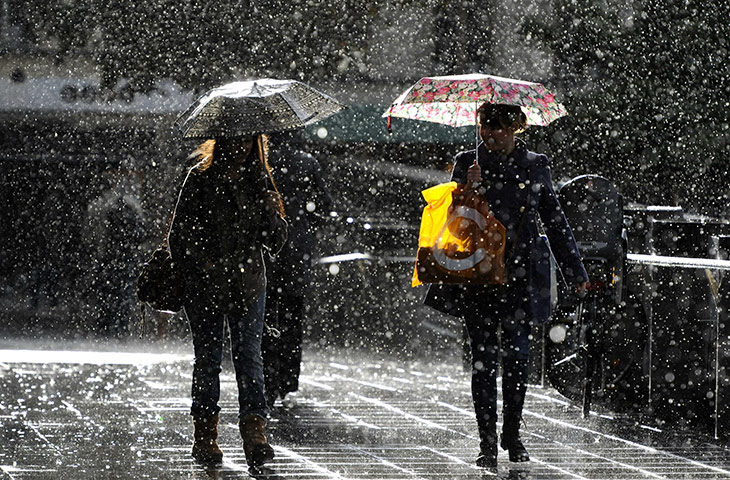 24 hours: Stockholm, Sweden: Evening commuters get caught in a rain shower