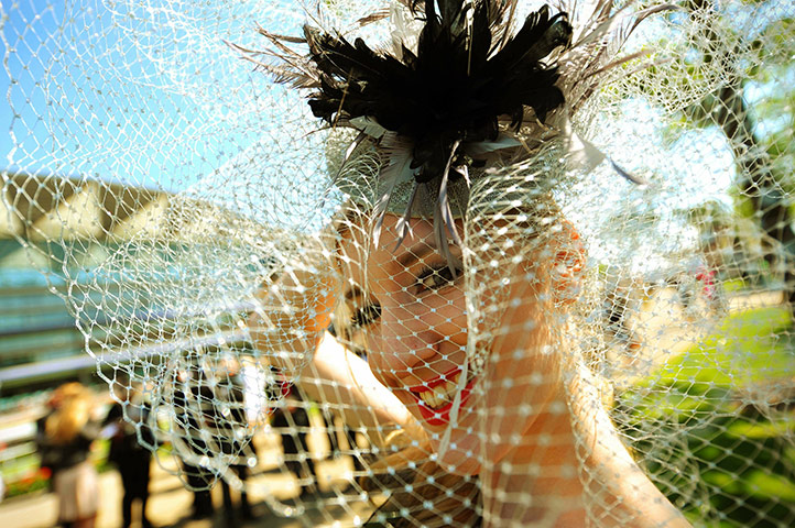 Wacky Hats: A racegoer looks through her veil at Ascot