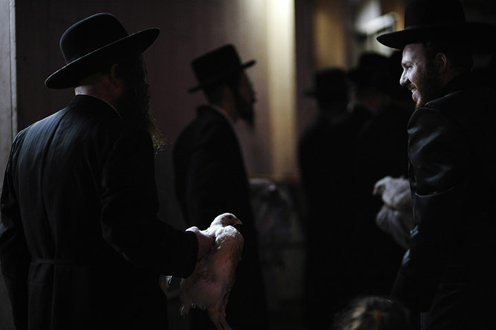 Yom Kippur: Ultra-Orthodox Jewish men perform the Kaparot ceremony