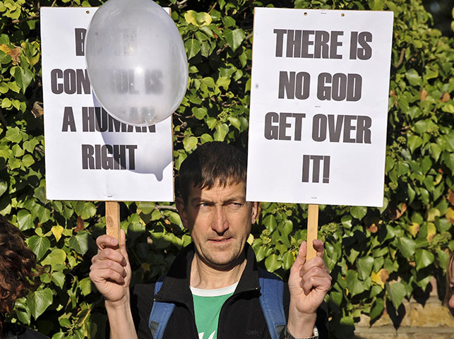 Pope Day 2: There is no God demonstrater as Pope arrives