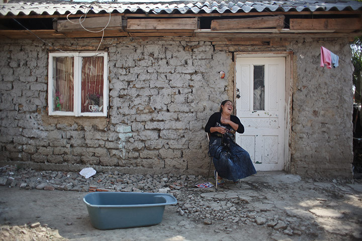 Roma in Romania: A Roma woman poses for a portrait in the village of Barbulesti, Romania