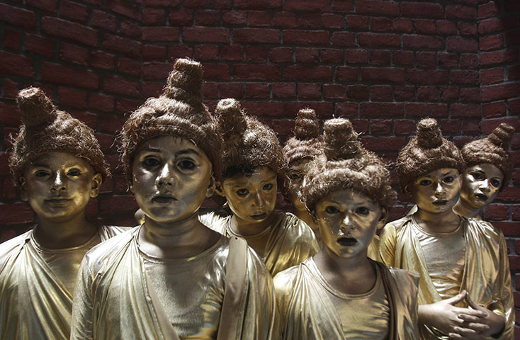 24 hours in pictures: Children dressed as Buddha in India