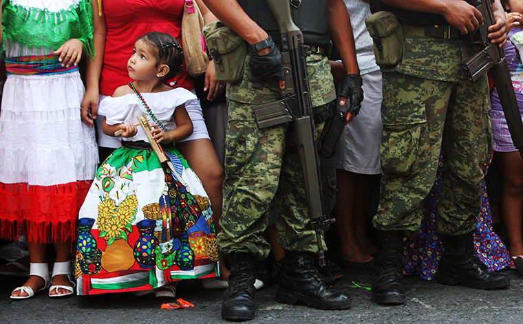 mexcico 2: A little girl wearing traditional clothes during a the parades