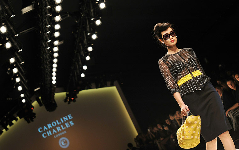 London Fashion Update: A Model walks down the catwalk wearing Caroline Charles