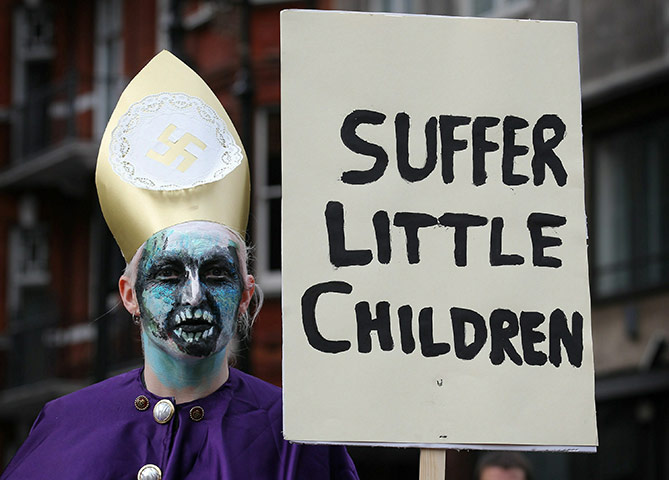Pope Day 2: A woman dressed as a Pontiff takes part in a demonstration near Hyde Park