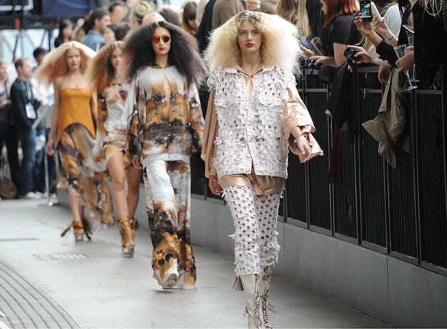 London Fashion Week Day 2: Models wear outfits at the Topshop Unique Fashion Show at Waterloo Station