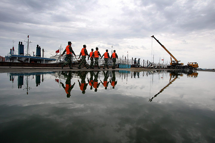 24 hours in pictures: Chinese security personnel move to inspe