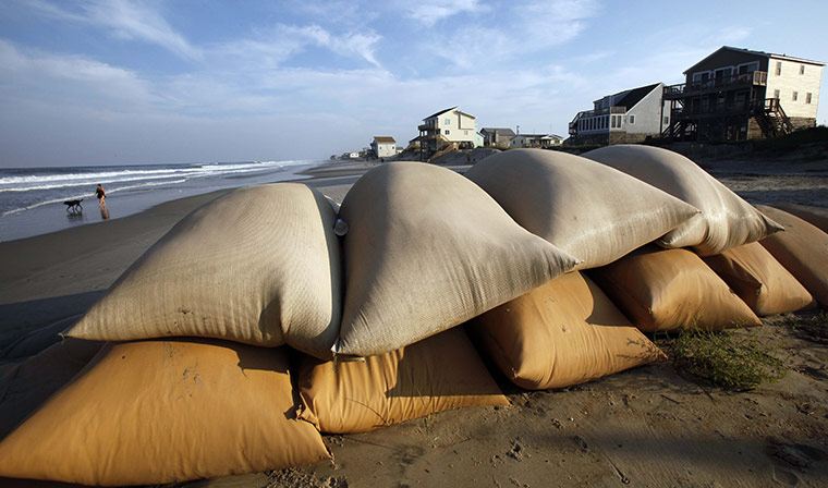Hurricane Earl: Sand bags that protected houses on the beach in Nags Head, N.C.