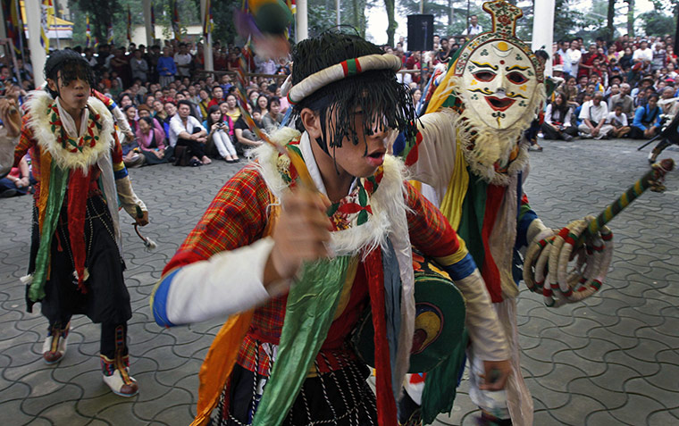 Tibetan Democracy Day: Exiled Tibetans perform a traditional dance at a temple in Dharmsala, India