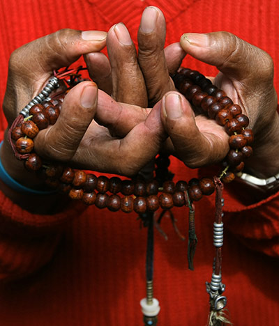 Tibetan Democracy Day: A Tibetan in-exile performs a religious ritual in Kathmandu