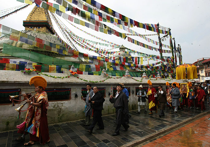 Tibetan Democracy Day: Tibetans-in-exile carry a photograph of the Dalai Lama of Democracy Day
