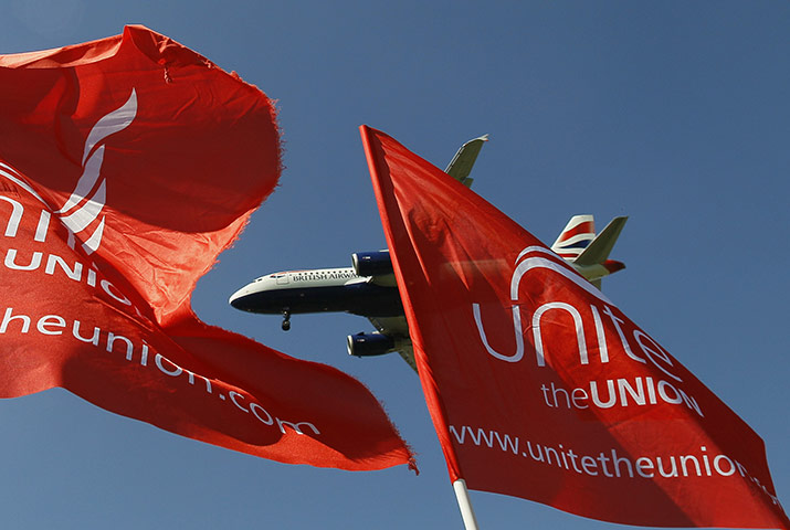 Week in Business: A British Airways plane comes in to land over protesters' flags