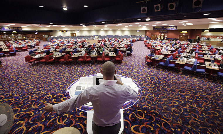 Week in business: A bingo caller calls the numbers at a Gala Bingo club in London 