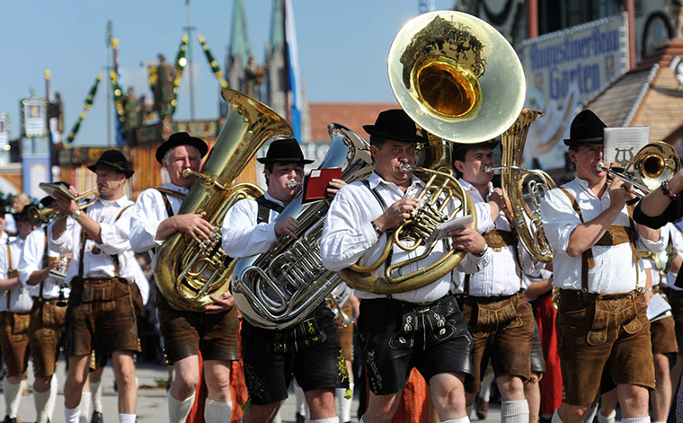 Oktoberfest in Munich: A traditional brass band takes part in a parade as Oktoberfest kicks off