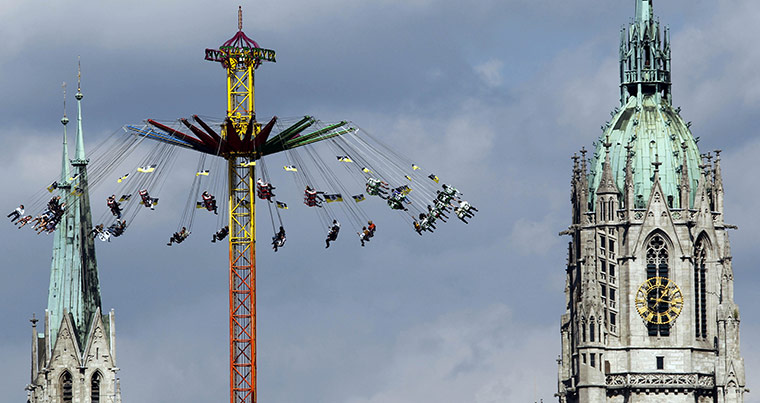 Oktoberfest in Munich: Visitors enjoy  the Oktoberfest in front of St Pauls church 