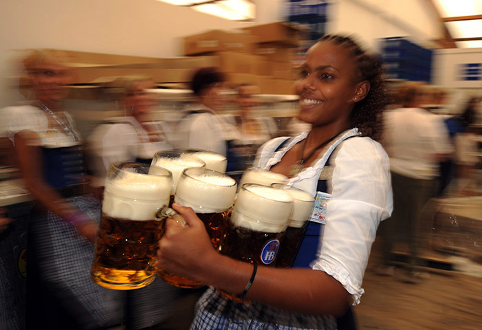 Oktoberfest in Munich: A waitress carries seven beers as the 2010 Oktoberfest kicks off 