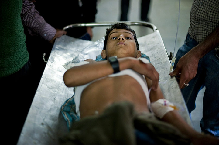 24 hours in pictures: Kashmiri boy Junaid Ahmed, 11, is taken