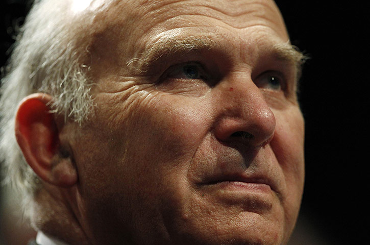 Liberal Democrats: Business Secretary Vince Cable listens to a speech