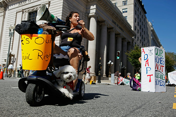 24 hours in pictures: Activist Protest Cuts To Long Term Health Care
