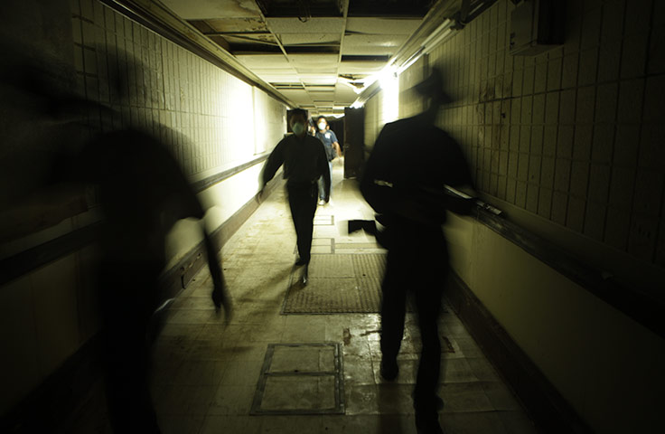 24 hours in pictures: Panama City, Panama: Journalists walk in a former U.S. army bunker