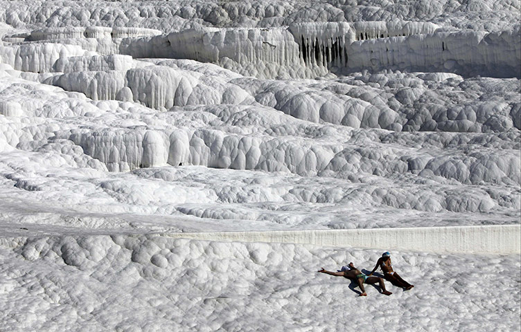 24 hours in pictures: People sunbathe at the Travertines in Pammakule