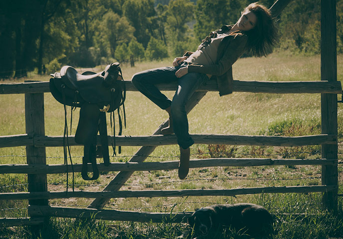 Ranch Fashion: Model sitting on gate
