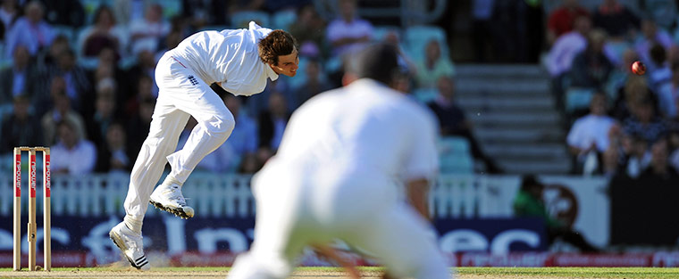 sport: England's Steven Finn (L) bowls on the f