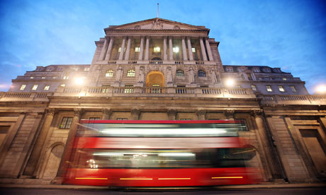 A bus passes the Bank of England in London.