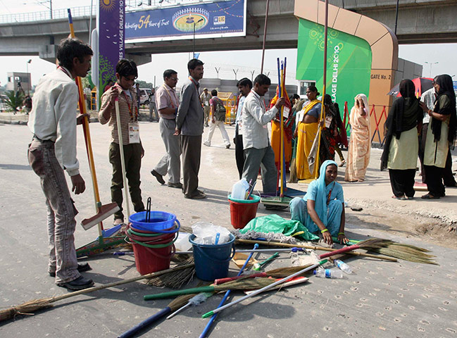 Commonwealth Games Clean: Workers prepare before entering the Commonwealth Games athletes village