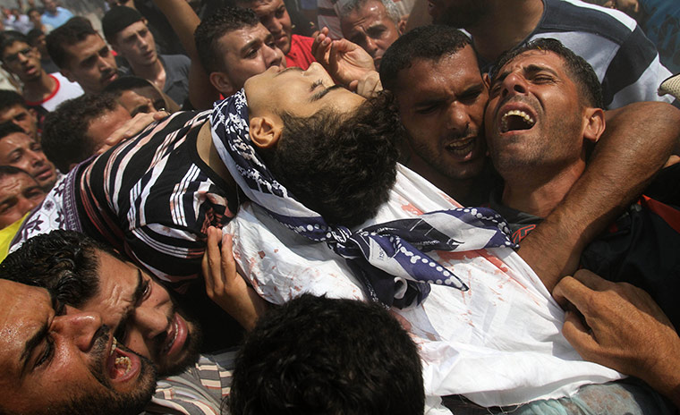 24 hours in pictures: fisherman killed in gaza