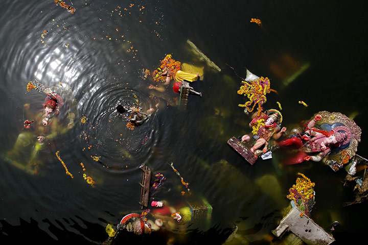 24 hours in pictures: Debris from Ganesh Chaturthi  in Ahmadabad, India