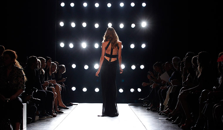 Milan Day 3 Update: A model presents a creation from the Gianfranco Ferre Spring/Summer 2011