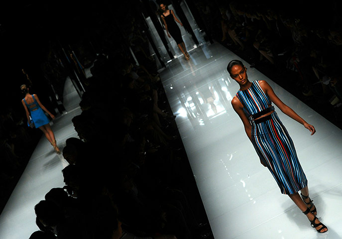 Milan Day 3 Update: A model displays a creation as part of Versace SS2011