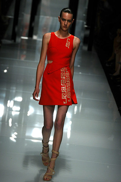 Milan Day 3 Update: A model displays a creation as part of Versace SS2011