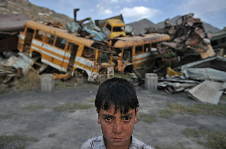 24 Hours: An Afghan youth at the abandoned Soviet occupation-era factory