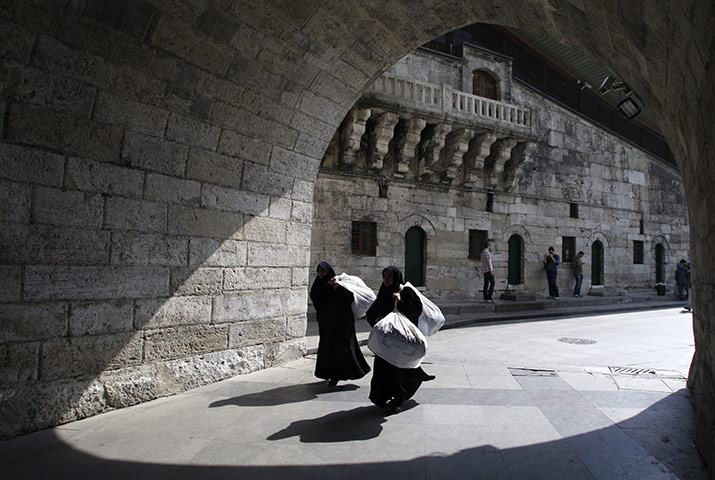 24 Hours: Istanbul, Turkey: Two women carry bundles down the street