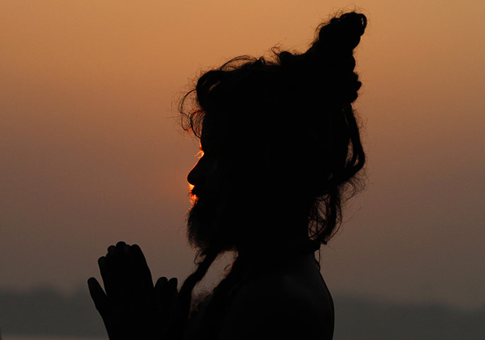 24 Hours: Allahabad, India: A sadhu, or Hindu holy man, prays 