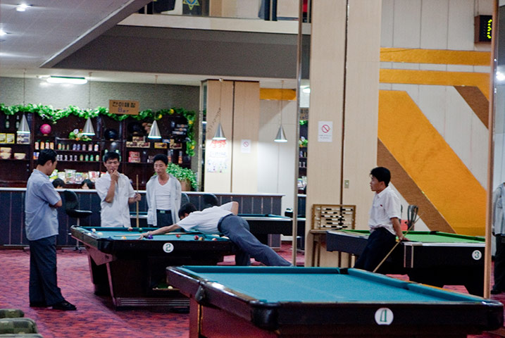 North Korea: Locals play pool at Pyongyang Gold Lane bowling alley