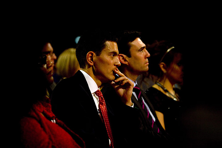 Labour party conference: David Miliband listens to his brother Ed Miliband's speech