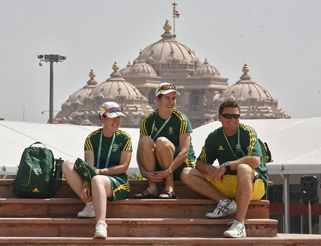 Commonwealth games Mon: Australian athletes sit in front of the Hindu temple at the Games village