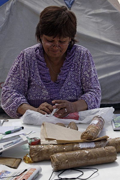 Trapped miners in Chile: 24 September: Griselda Godoy packs clothes to be sent to her son
