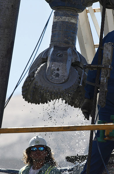 Trapped miners in Chile: 24 September: A man works next to the bit of the RIG-421 drill
