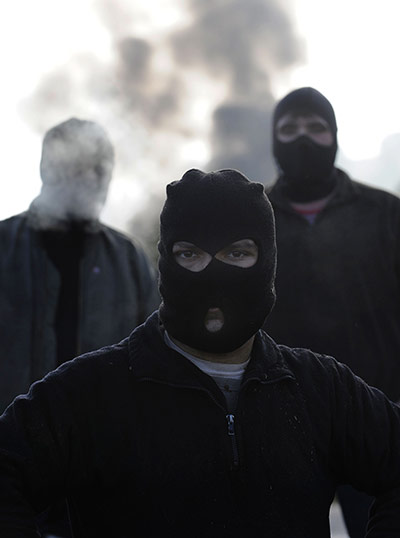 24 hours: Coal miners stand by a burning barricade in northern Spain