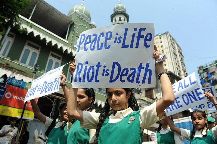 Ayodhya dispute: Indian schoolchildren hold placards calling for calm and peace